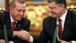 Ukrainian President Poroshenko shakes hands with Turkey's President Erdogan after a signing ceremony in Kiev