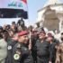 Иракские генералы устанавливают государственный флаг над развалинами мечети аль-Нури